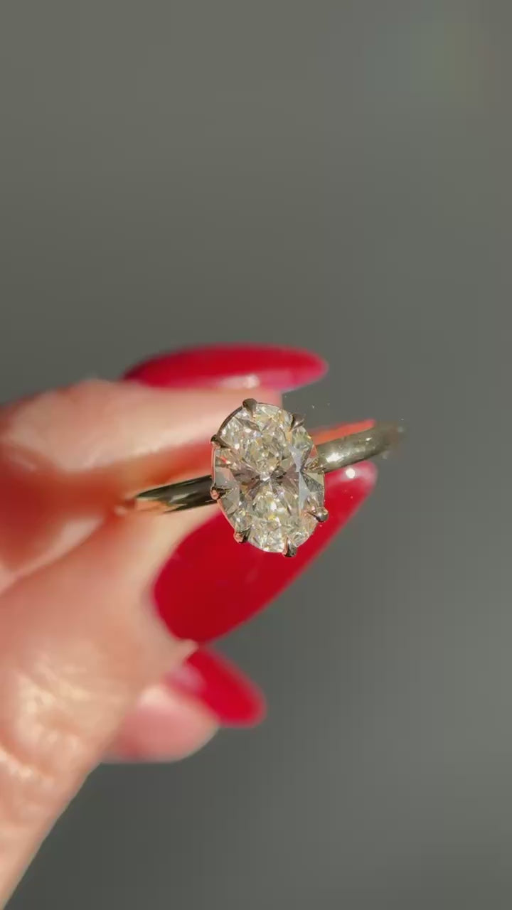 Eight claw oval engagement ring